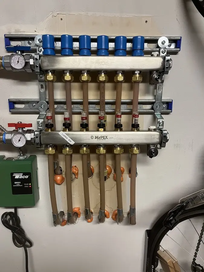 Plumber performing Water Heater Repair at a residential property in McRae-Helena